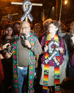 Kathleen and Padre Melo at a protest in Honduras